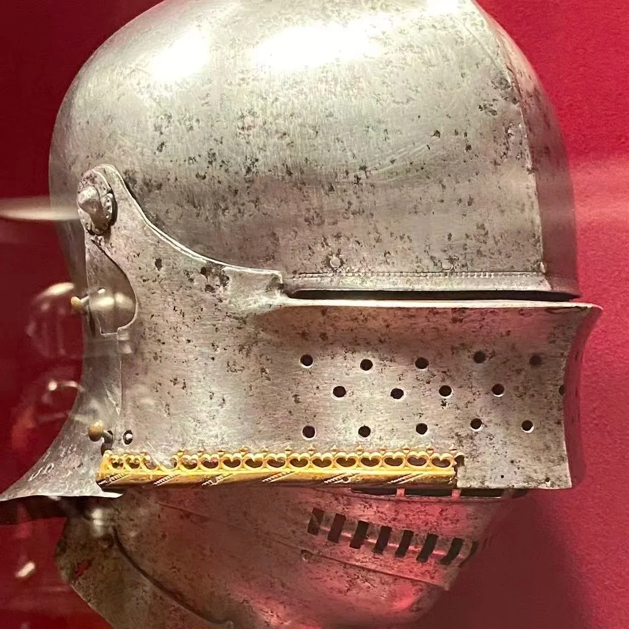 Worn metal helmet reference photo from the MET museum