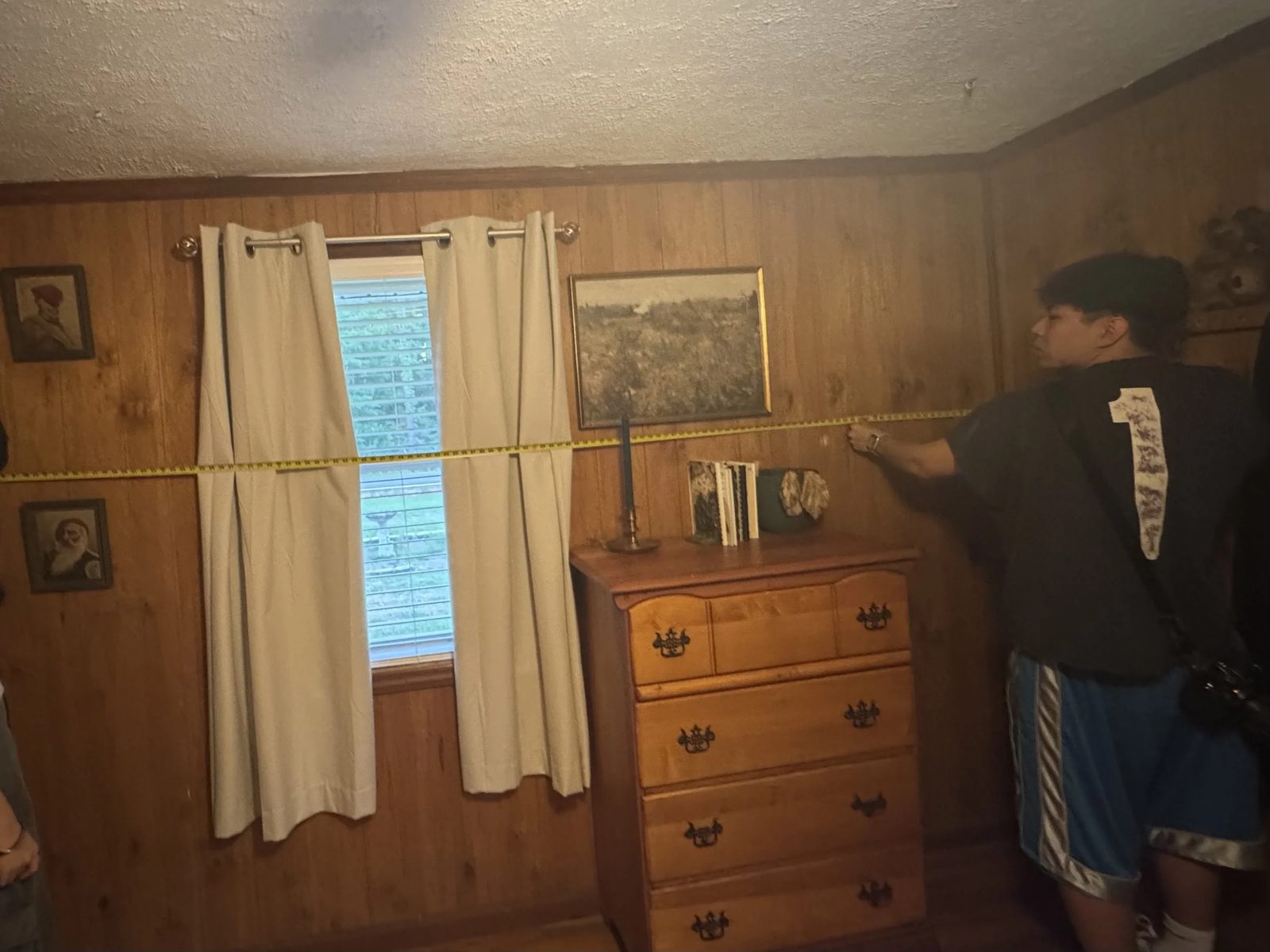 On set — measuring room dimensions for camera-matching
